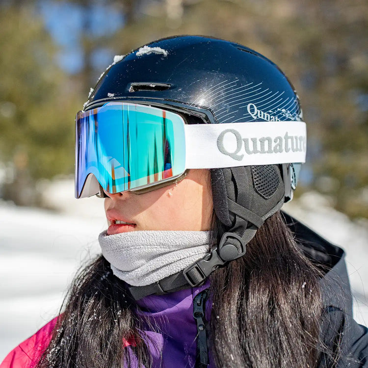 A man wearing a snow helmet in the snow