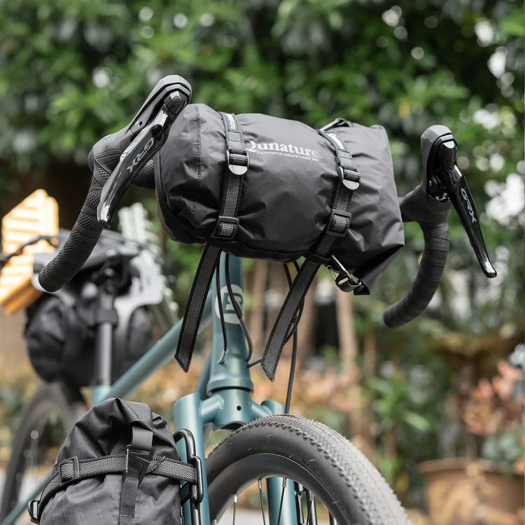 A strap holding a seat cushion to a bicycle