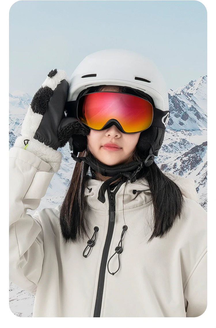 A girl wearing black frames of ski goggles with red lenses