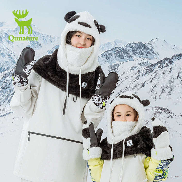 Two little girls wearing head covers in the snow
