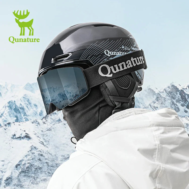 A man wearing a snow helmet in the snow