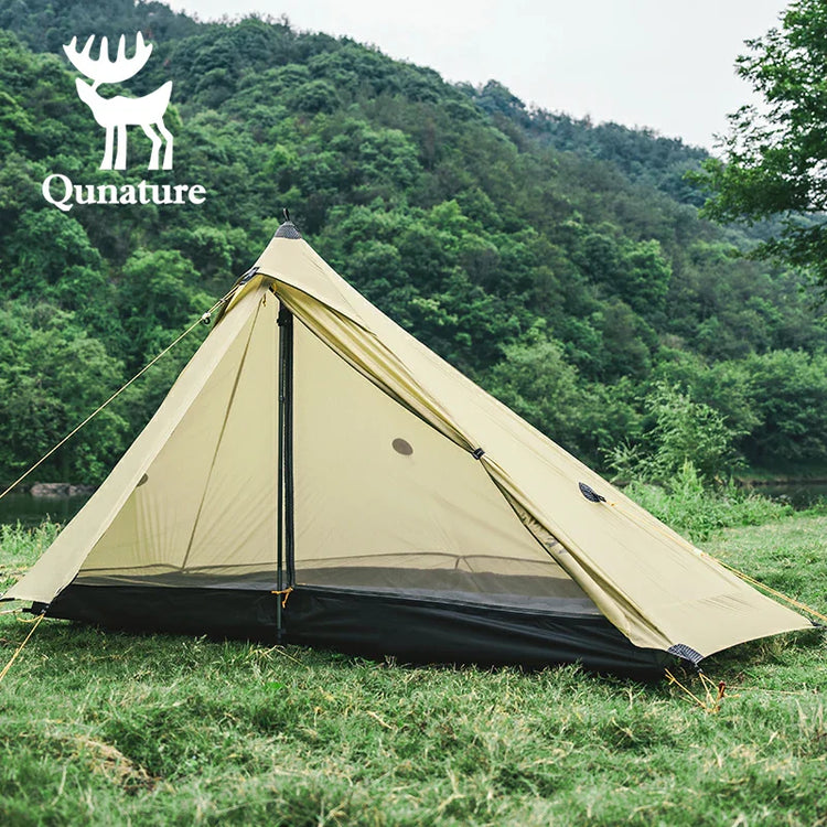 A beige canopy on the outdoor grass