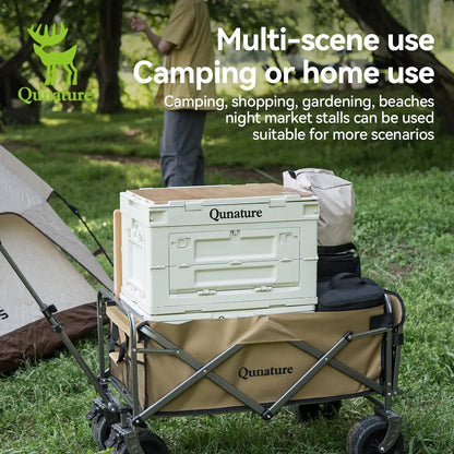 Camping cart with storage crate in a grassy area, featuring Qunature branding.
