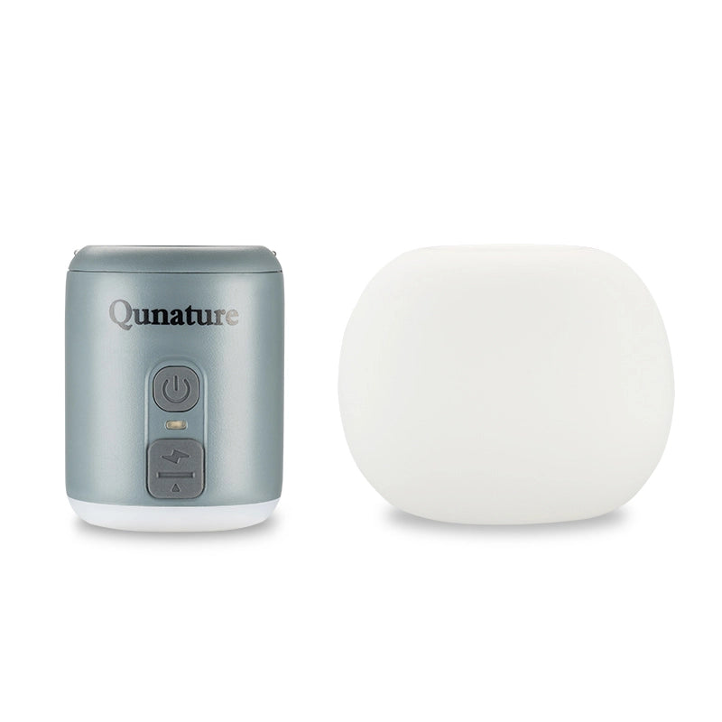 Gray device with control panel and a white spherical object on a white background, branded 'Qunature'.