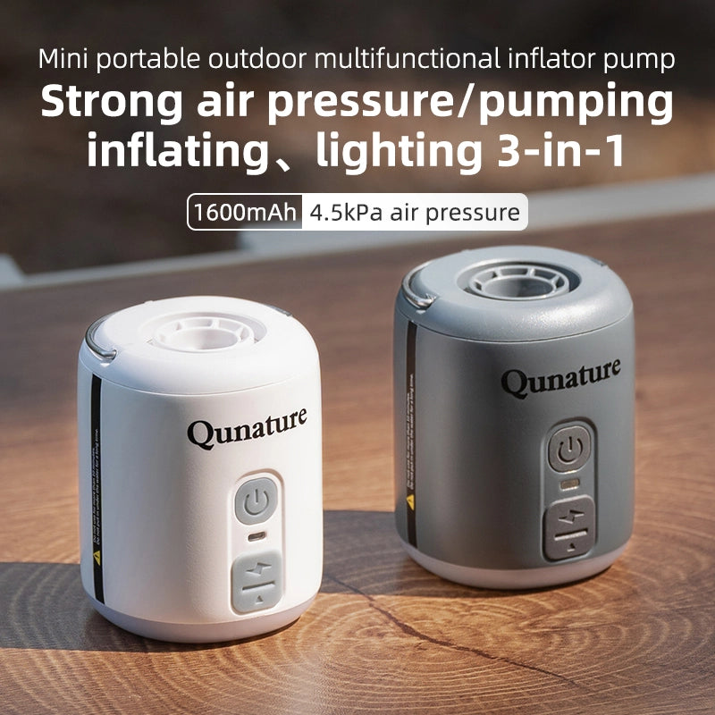 Two Qunature mini portable outdoor multifunctional inflator pumps on a wooden surface.