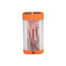 A cylindrical portable power bank with a clear body showing a pink and black topographic line pattern, finished with bright orange top and bottom caps. The brand name 'Qumaurus' is printed vertically on the center.