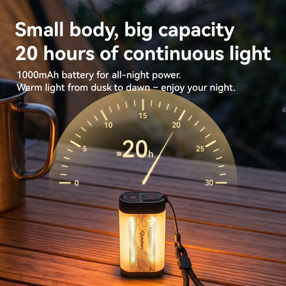 A small cylindrical portable light with a black top and bottom, glowing warm yellow light inside, shown on a wooden table outdoors at dusk. A large semi-circular graphic overlay shows a 20-hour battery indicator, with marketing text above reading 'Small body, big capacity 20 hours of continuous light 1000mAh battery for all-night power.