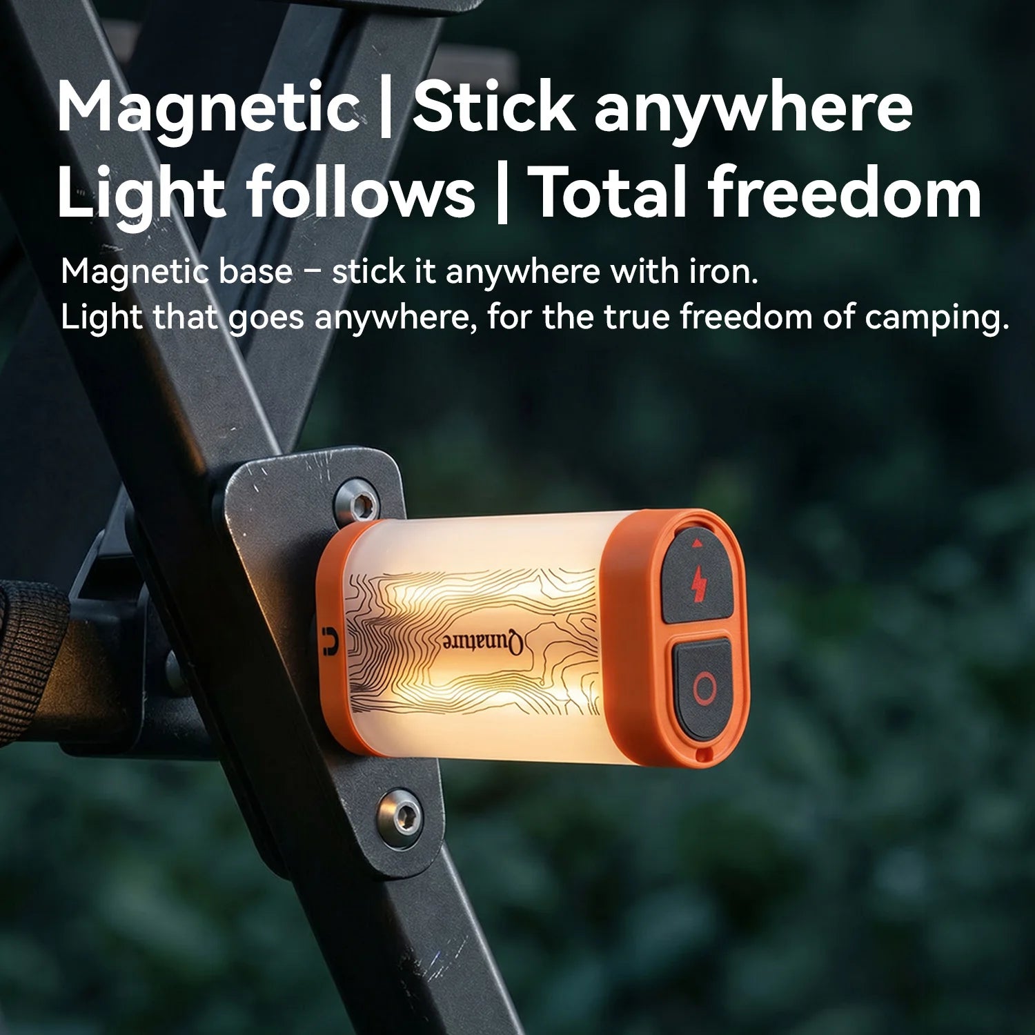 A small cylindrical camping light with an orange end cap and glowing warm-white body, mounted on a black metal frame outdoors. Large text at the top reads 'Magnetic | Stick anywhere | Light follows | Total freedom' with a smaller explanatory subtitle.