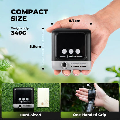 A hand holding a compact black and silver electronic device labeled 'Qunature' with dimension callouts showing 8.7cm width, 8.