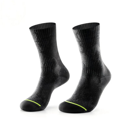 A pair of black ribbed crew socks with a thin neon yellow-green accent line near the toes, displayed against a solid white background.
