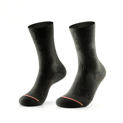 A pair of black ribbed crew socks with a thin orange accent line near the toes, displayed on a clean white background.