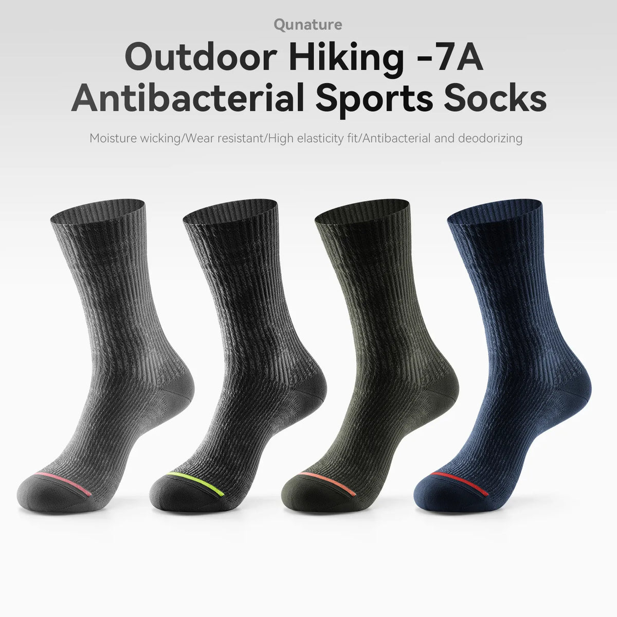 Four pairs of ribbed athletic socks shown on invisible forms against a light gray background, with text at the top reading 'Outdoor Hiking -7A Antibacterial Sports Socks.' The socks come in dark gray, black, charcoal, and navy, each with a small colored accent line near the toe.