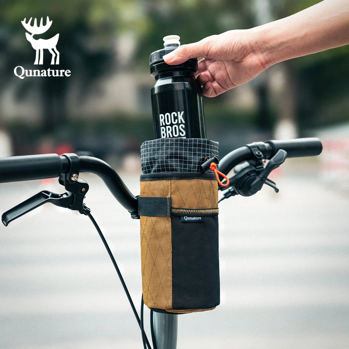 A black water bottle is being put into a khaki water bottle bag with a drawstring