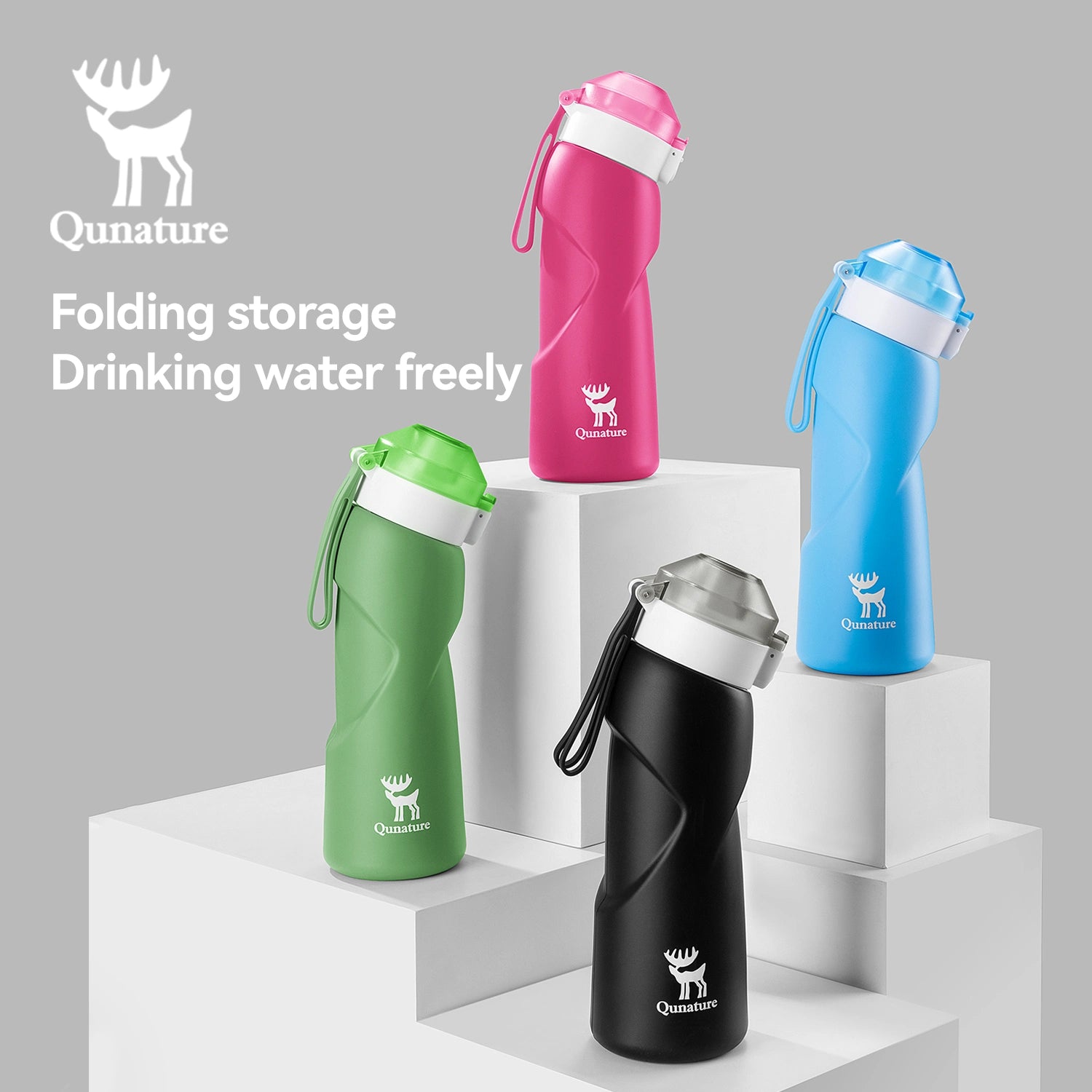 Four Qunature water bottles in different colors on a gray background