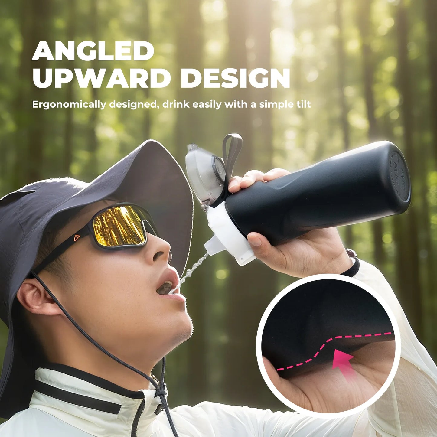 Person drinking from a black water bottle with an angled upward design in a forest setting.