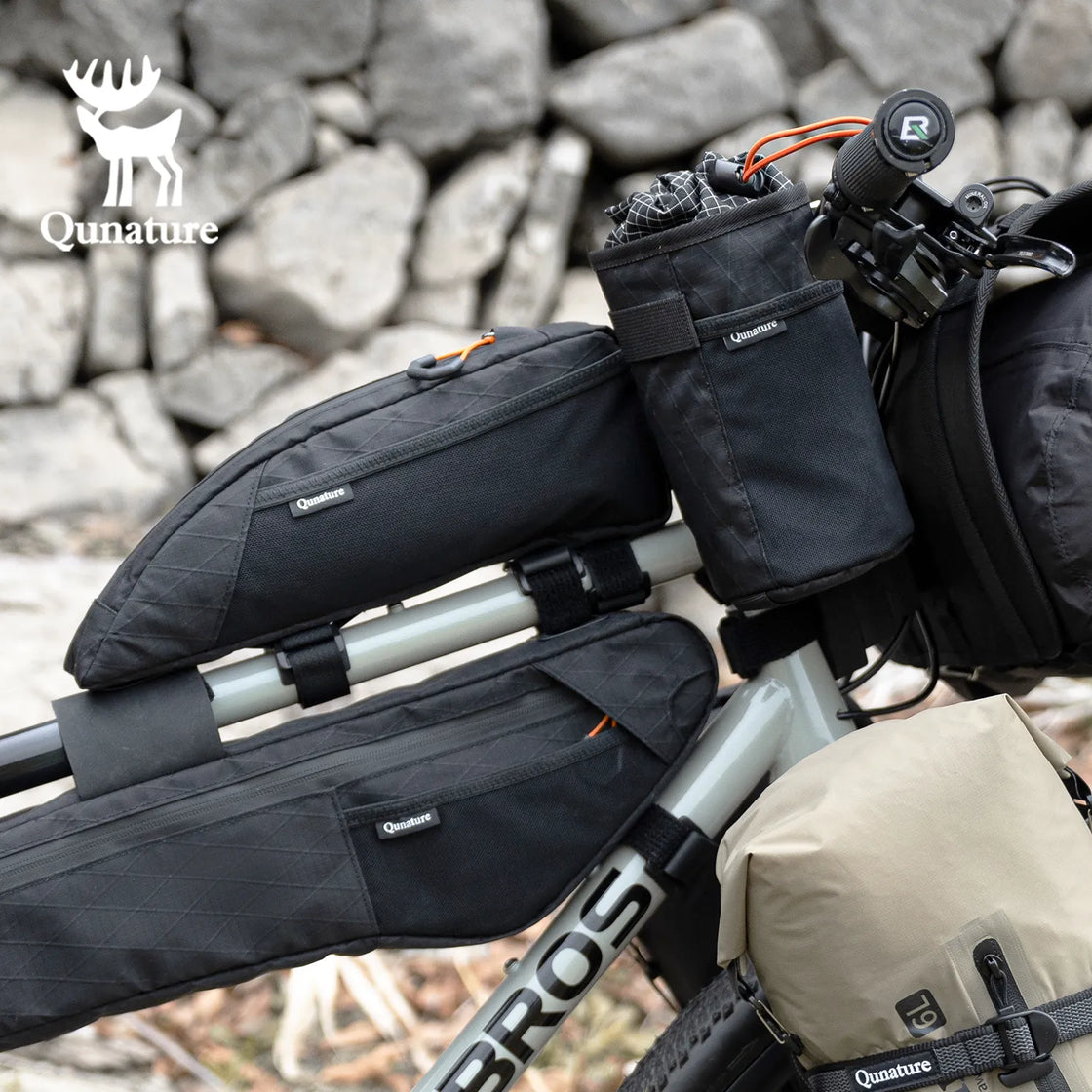 This top tube bag is installed on a bicycle along with many bike frame bags