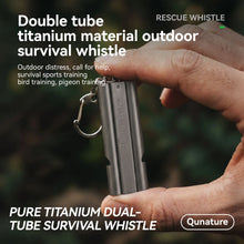 A hand holding a metallic gray double-tube titanium outdoor survival whistle with a keychain ring. The image features promotional text highlighting its pure titanium dual-tube construction and outdoor use cases, with the brand name 'Qunature' visible.