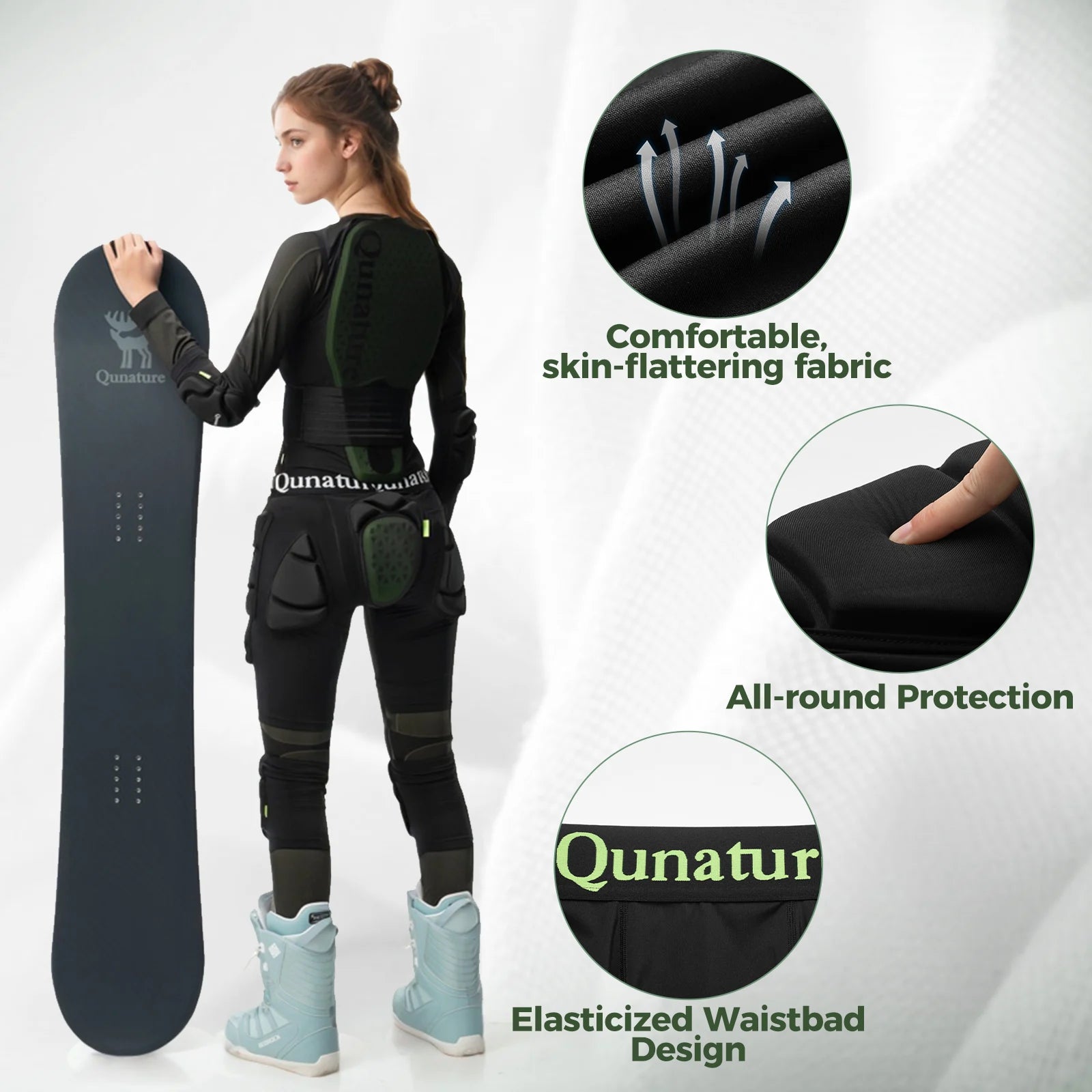 Person wearing a black snowboarding outfit with Qunatur branding, holding a snowboard.
