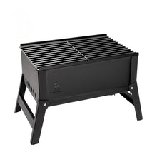 Black portable grill with a grid on a white background