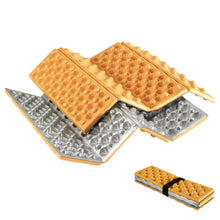 Waffle maker with two waffles on a white background