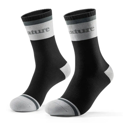 Pair of black socks with gray accents on a white background