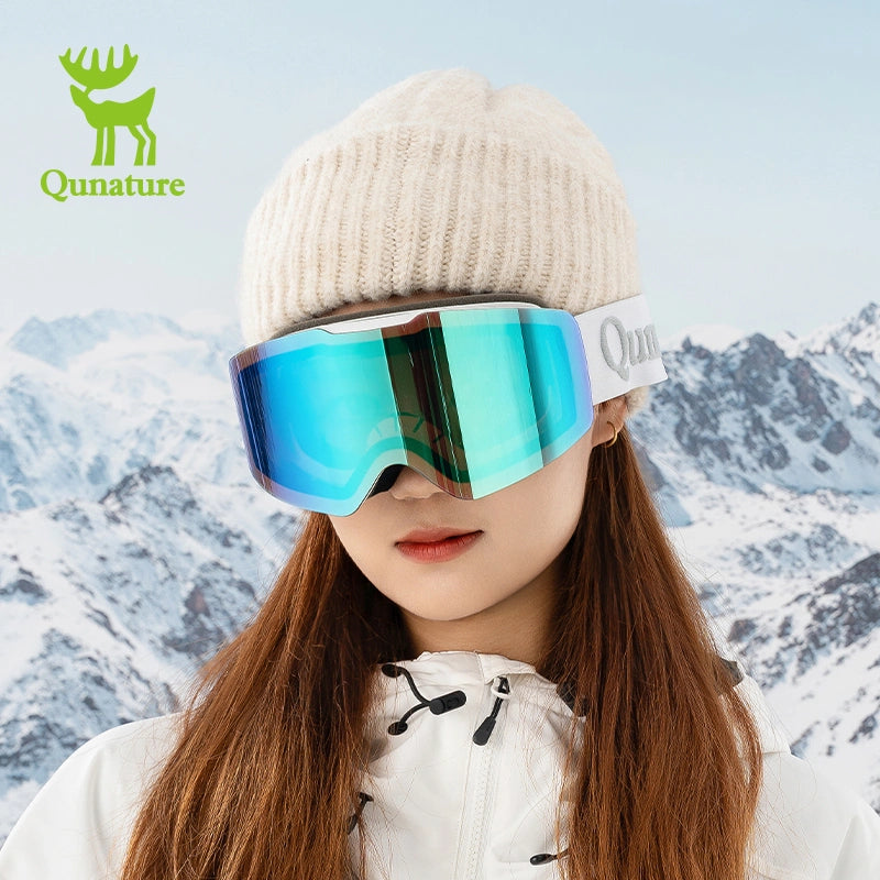 A girl wearing frameless blue anti-fog ski goggles