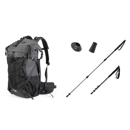 Black hiking backpack with two trekking poles on a white background