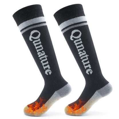 Black knee-high socks with 'Qunature' branding and flame pattern on sole against a white background