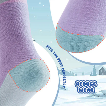 Close-up of purple and light blue socks with text on a snowy landscape background