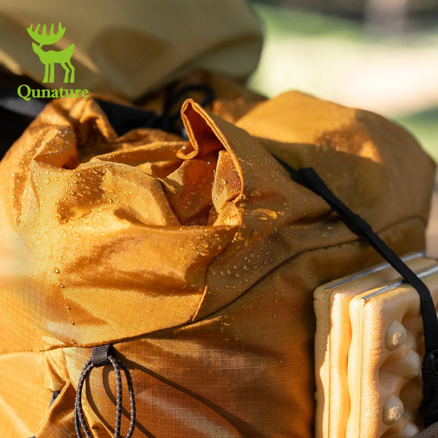 a lightweight waterproof hiking backpack with water droplets on the surface