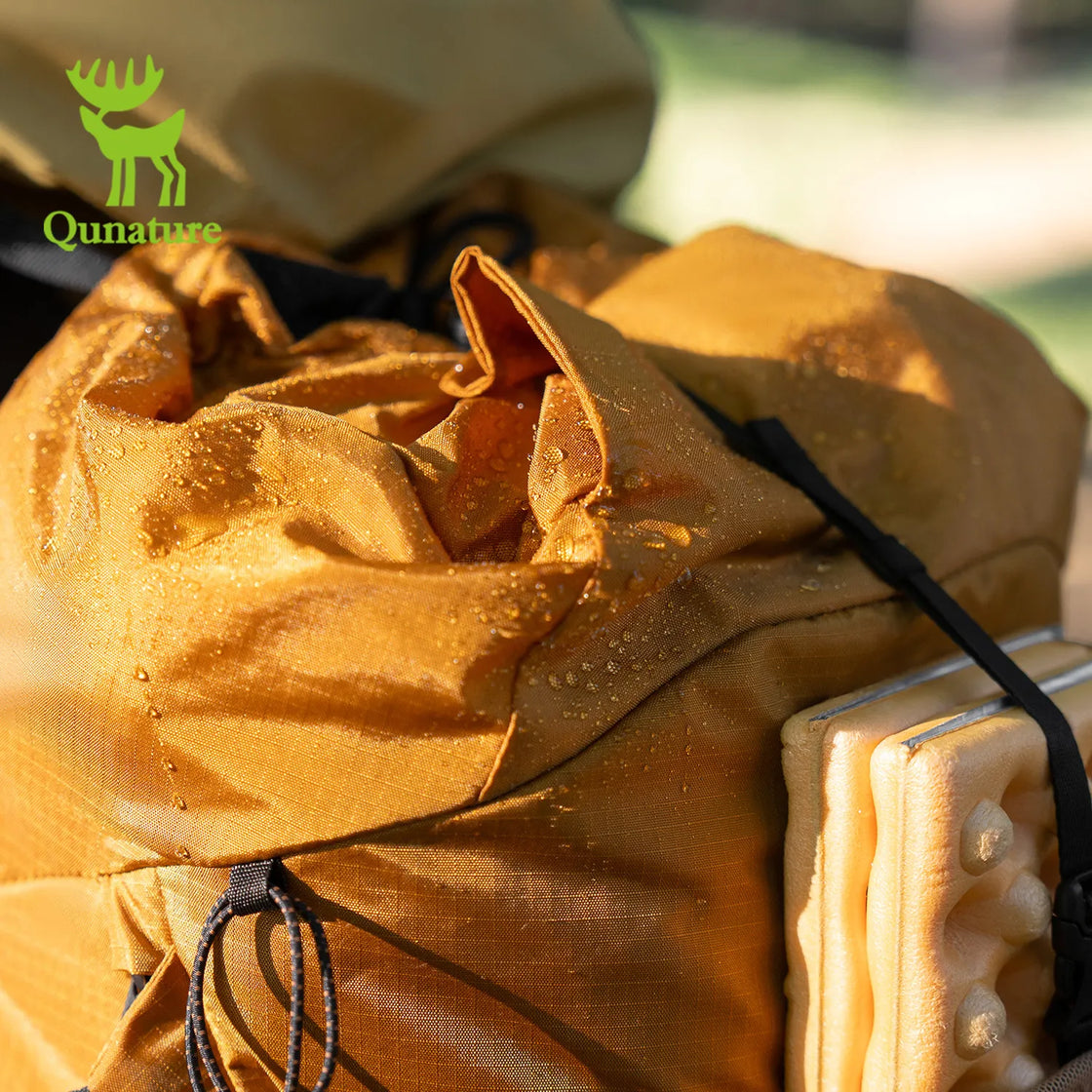 a lightweight waterproof hiking backpack with water droplets on the surface