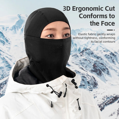 Person wearing a black balaclava with text about its ergonomic design against a snowy mountain background.