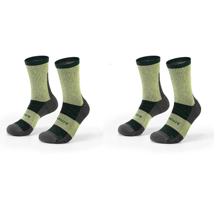 Two pairs of crew socks shown on invisible forms against a white background. The socks are light olive green with dark green and dark gray accents, featuring the brand name 'Qunature' printed on the side.