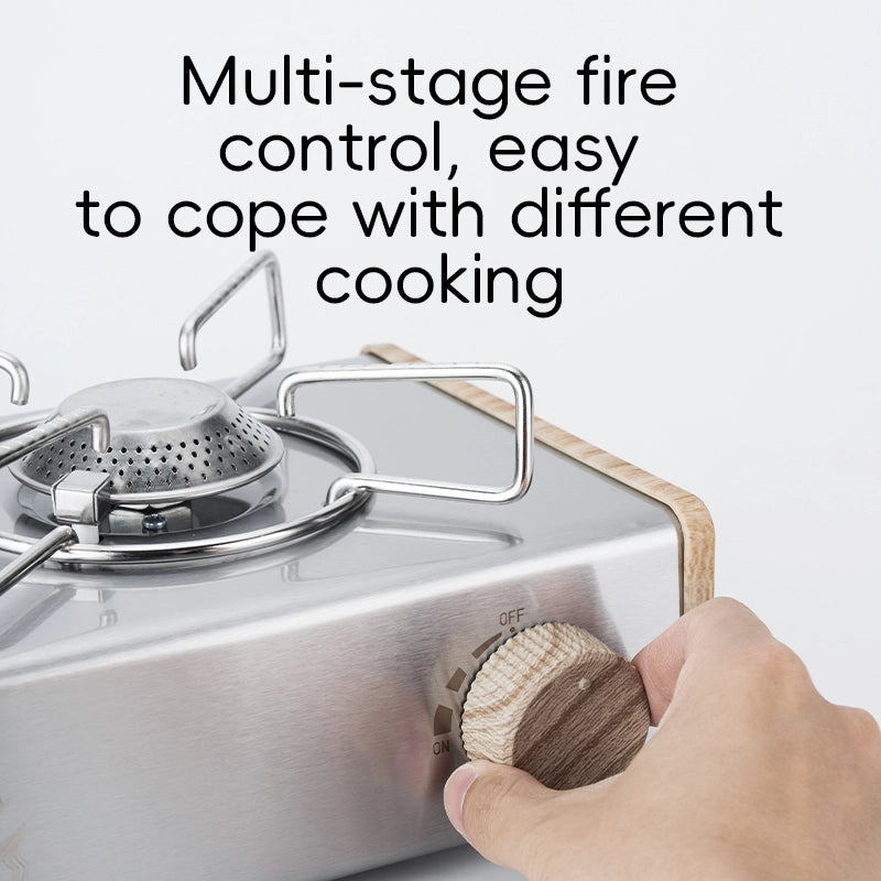 Hand adjusting a knob on a portable stove with text about multi-stage fire control.