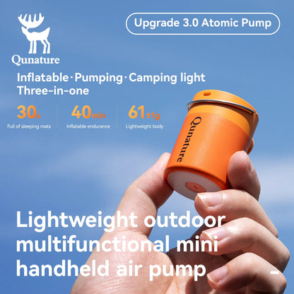 An ultra-light mini orange electric air pump is held in the hand
