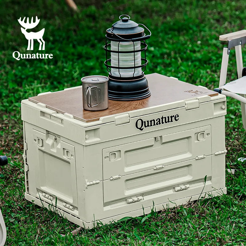 Qunature outdoor cooler with a lantern and mug on a grassy background
