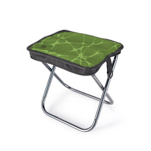 A compact folding camp stool with a green patterned cushion on a silver metal frame, shown on a white background.