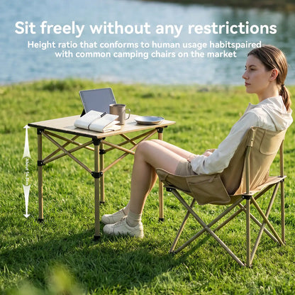 Woman sitting at a portable table and chair set in a grassy outdoor area with text about height ratio.