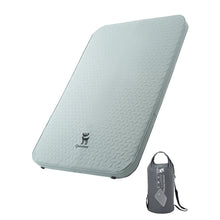 Light green camping mattress with a carrying bag on a white background