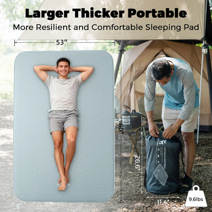 Portable sleeping pad with a person lying on it and another person packing it into a bag, with camping equipment in the background.