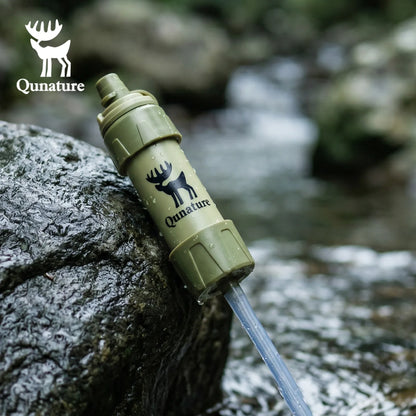 Qunature water filter being used to draw water from a stream.
