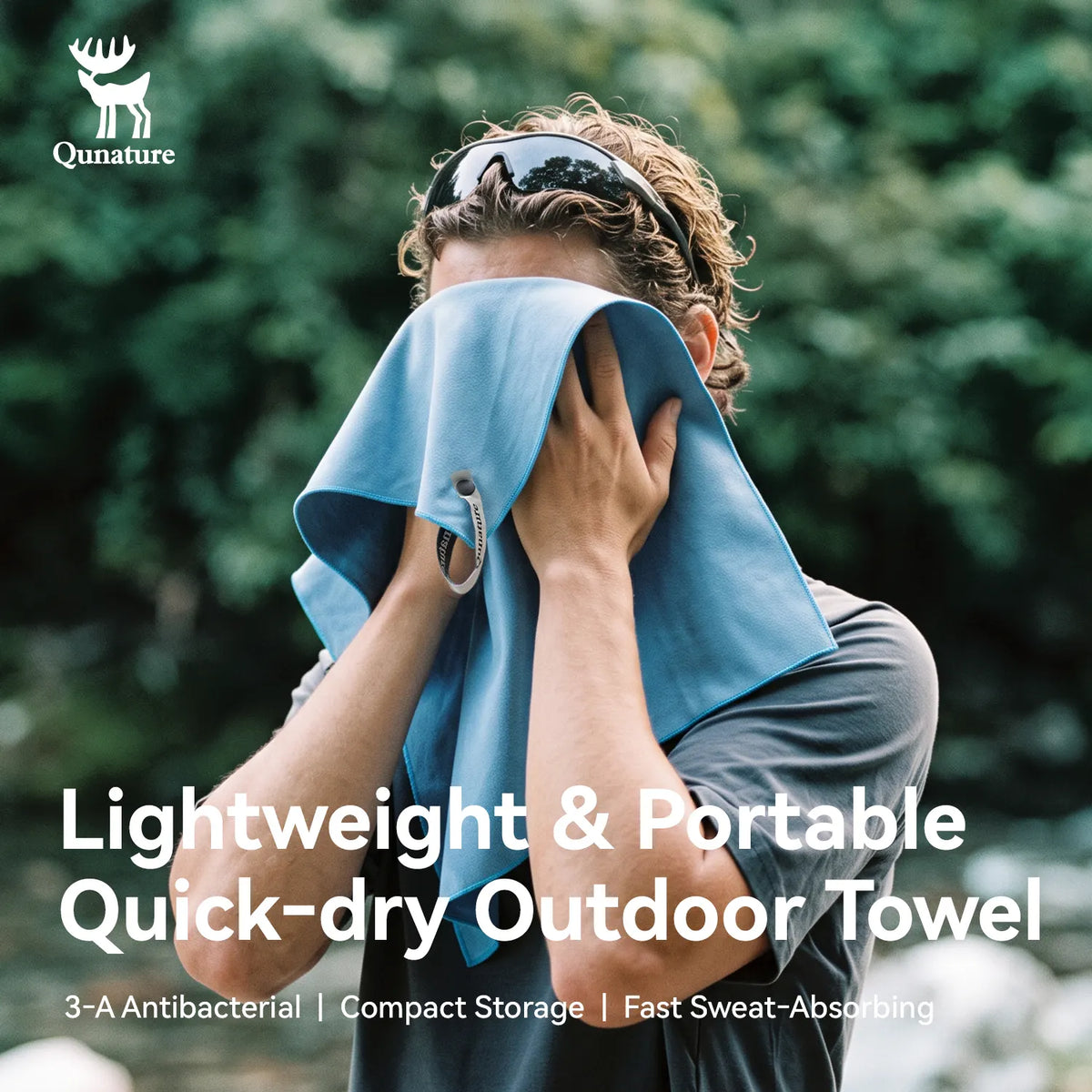 A man outdoors drying his face with a light blue quick-dry towel. The image features the Qunature brand logo in the top-left corner and text overlays at the bottom highlighting the towel's lightweight, portable, and quick-dry qualities.