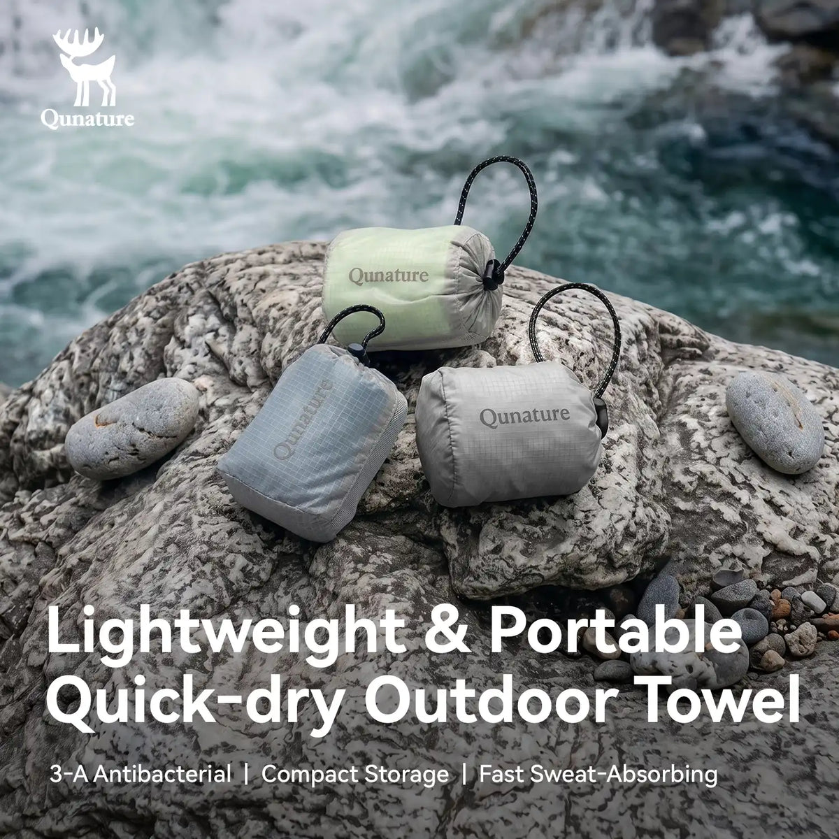 Three compact, lightweight Qunature outdoor towels in different colors (mint green, light gray, and medium gray) are shown resting on a large rock in a river with rushing water in the background. Text overlays describe the product as 'Lightweight & Portable Quick-dry Outdoor Towel' with key features listed below.