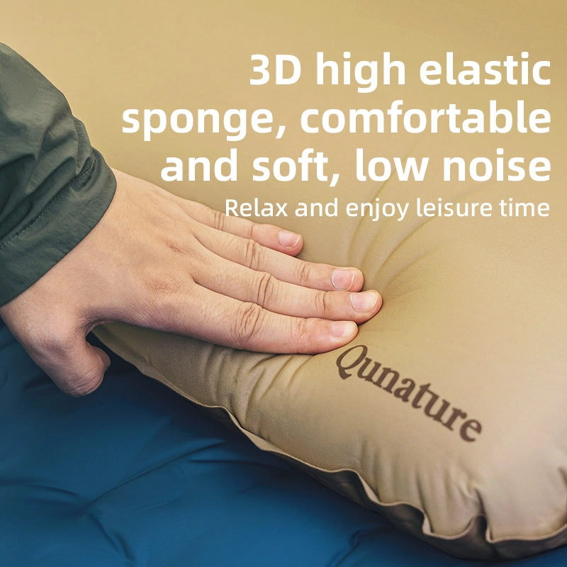 Inflatable pillow with a hand pressing on it, featuring the brand 'Qunature'.