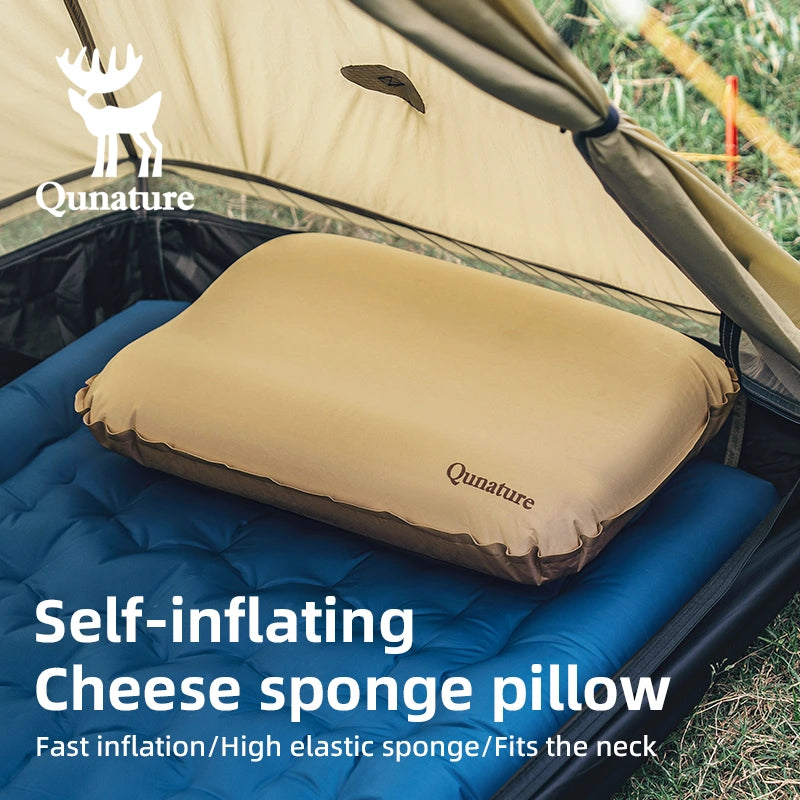Self-inflating cheese sponge pillow on a camping mattress with Qunature branding.