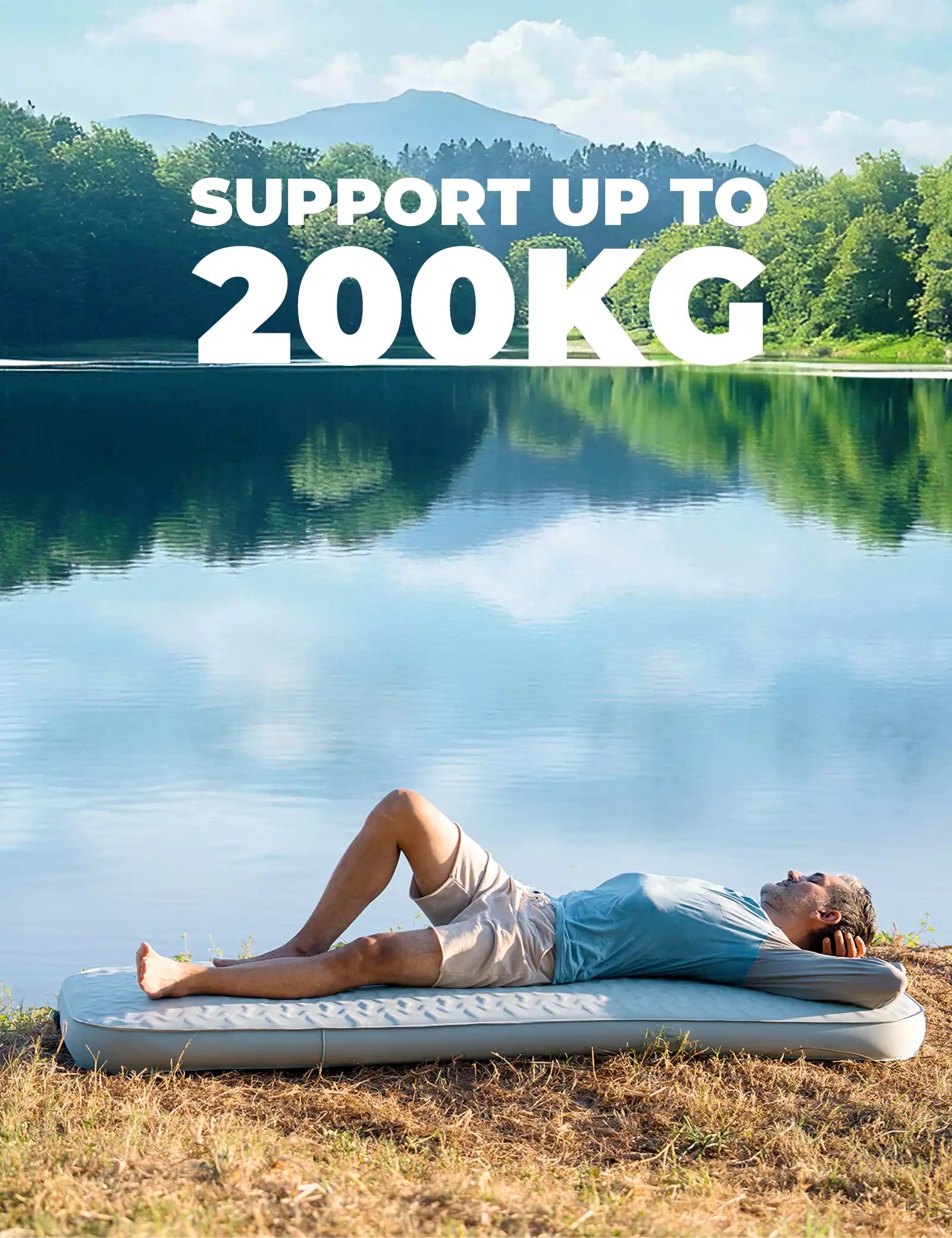 Person lying on an inflatable mat by a lake with text indicating weight capacity.