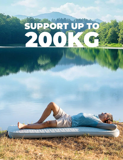 Person lying on an inflatable mat by a lake with text indicating weight capacity.