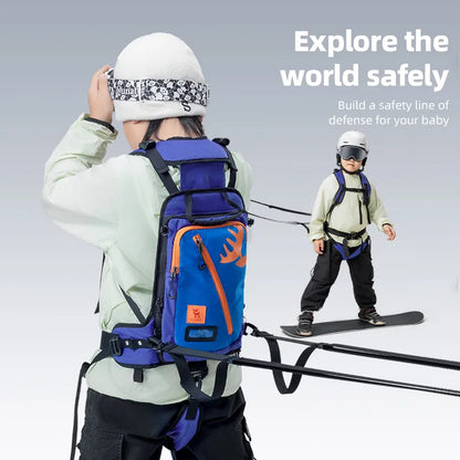 A little boy wearing a hat is skiing with a ski training strap with storage pockets