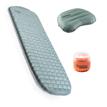 A Qunature sleeping pad in a dusty blue-gray color, shown fully inflated alongside its matching inflatable pillow and an orange manual pump on a clean white background.