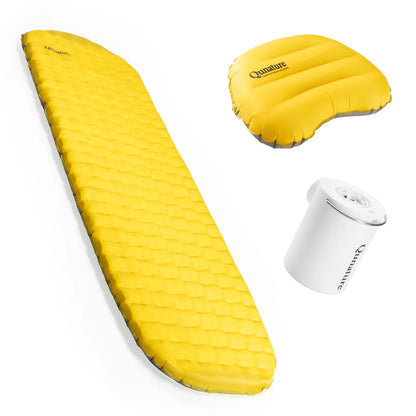 Yellow camping mattress, pillow, and pump set on a white background